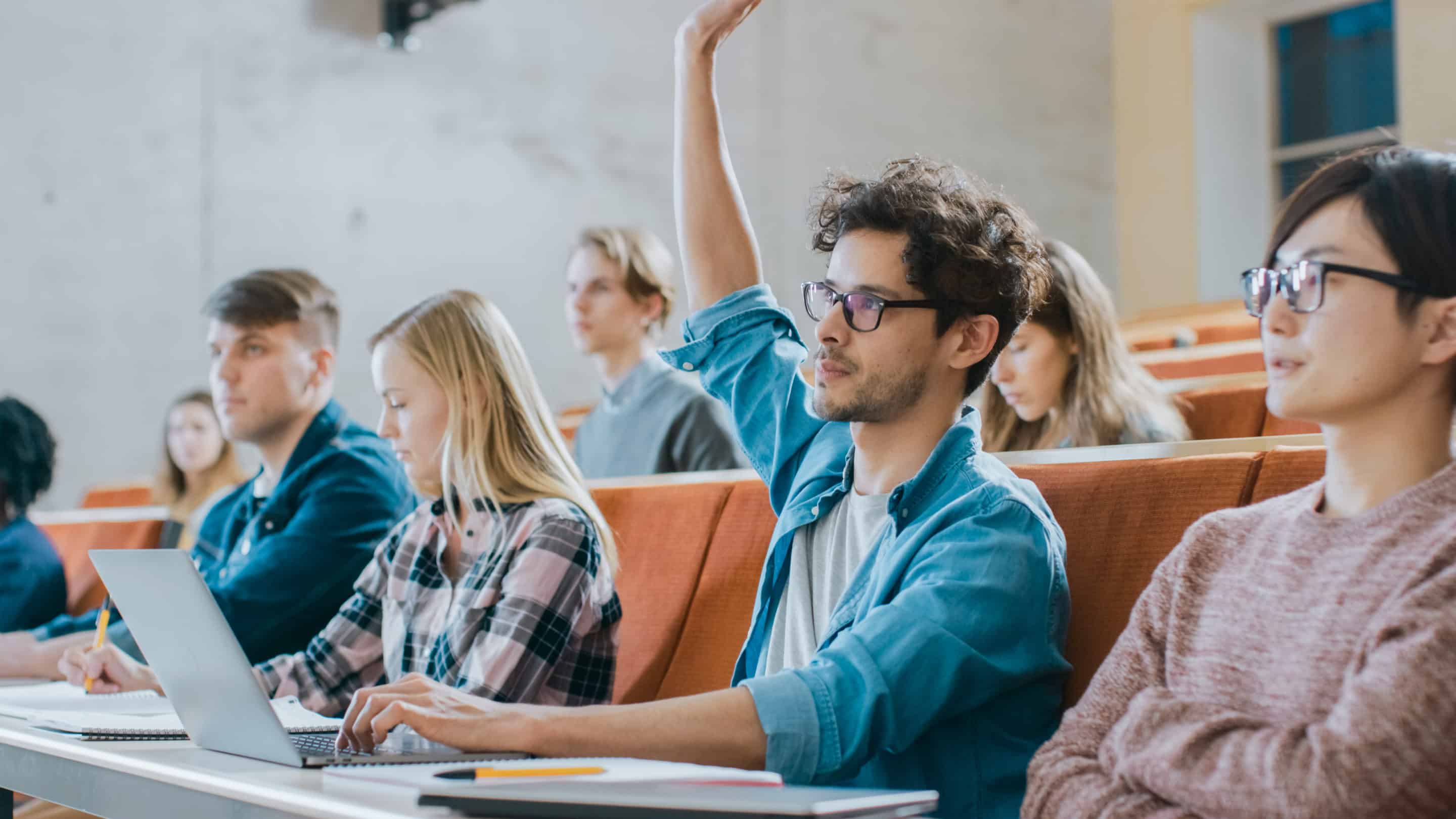 Man raising his hand in a classroom