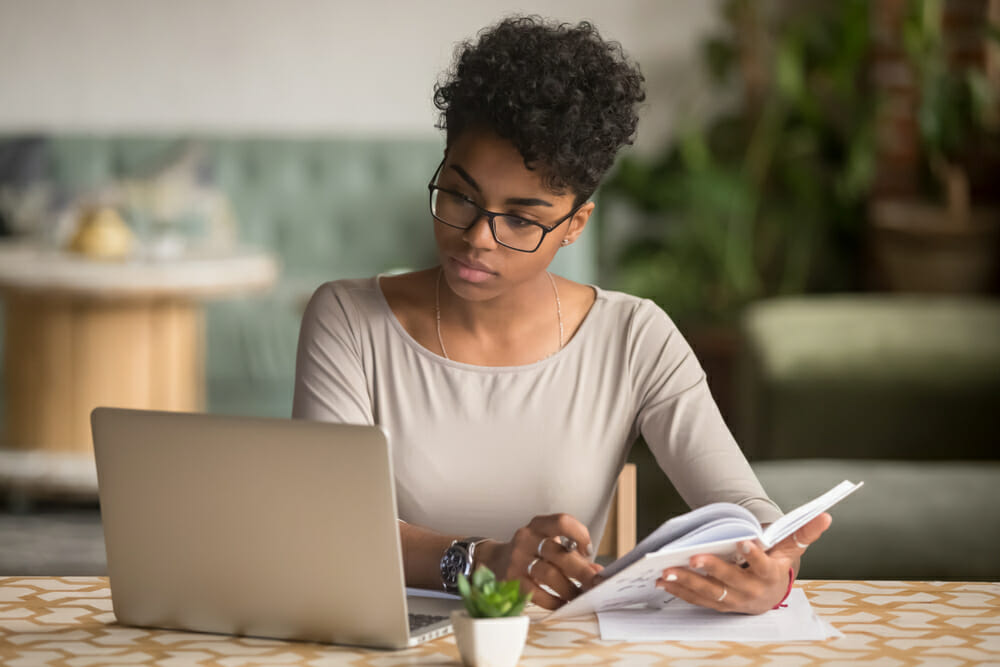 woman with a notebook and computer